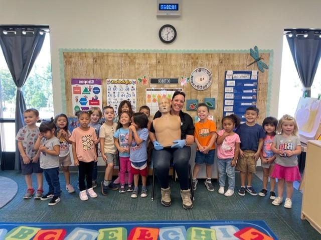 Children and instructors with safety dummy